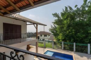 a view from the balcony of a house with a swimming pool at Casa com piscina até 8 pessoas 10 minutos da Oktoberfest in Blumenau