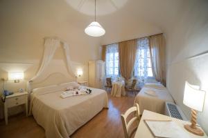 Postel nebo postele na pokoji v ubytování Albergo Etruria
