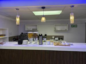 a counter in a kitchen with some food on it at Drame MC Good Night Lodge in Cape Town