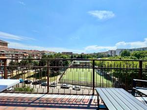 a balcony with a view of a parking lot at LUXURY APARTMENT OPEN SPACE with garden & free parking in Turin