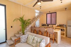 a living room with a couch and a table at CALIXTO Villa 4 in Bucerías