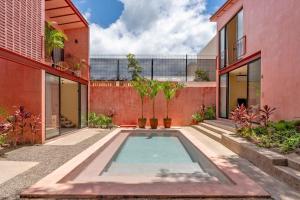 an indoor pool in the courtyard of a house at CALIXTO Villa 4 in Bucerías