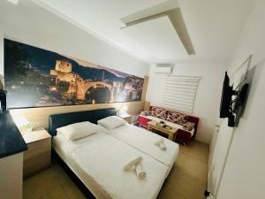Ένα ή περισσότερα κρεβάτια σε δωμάτιο στο Apartments City Center Mostar