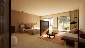 un soggiorno con un letto e una televisione di ARATO by E-GEO, Adults Only a Città di Kos