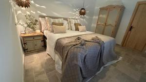 a bedroom with a large bed in a room at Finca Celia Competa in Cómpeta +64 photos
