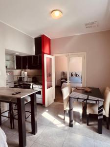 a kitchen with a table and chairs and a dining room at Colorado in Mendoza