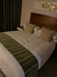 Ένα ή περισσότερα κρεβάτια σε δωμάτιο στο Simply Stay Suncity