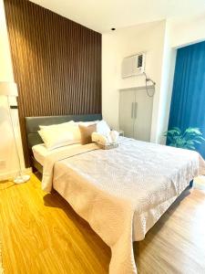 a bedroom with a large bed in a room at Novotel Tower at Mandaluyong Rockwell View in Manila +24 photos