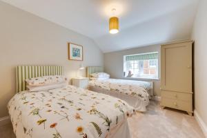 Postel nebo postele na pokoji v ubytování Knapton Hall Cottage + 5 fotografií
