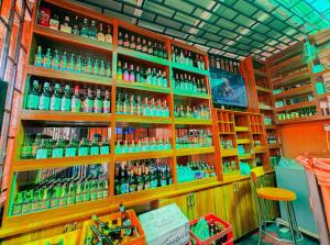 a store filled with lots of bottles of alcohol at Sunbeam BnB Bweyogerere in Kampala