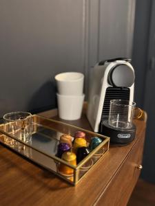 a tray of food on a wooden table at Suite Romantique, hyper centre in Caen +17 photos