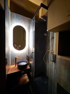 a bathroom with a sink and a mirror at Suite Romantique, hyper centre in Caen +17 photos