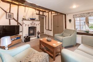 Posezení v ubytování Cobblers Cottage