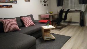 a living room with a couch and a table at Ferienhaus Mosel/Trittenheim in Trittenheim