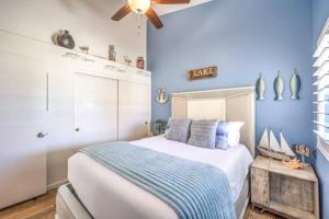 a blue bedroom with a bed and a ceiling fan at Family Fun for Everyone in Las Vegas- 4 Bedrooms, Billiards, Game Room in Las Vegas +36 photos