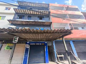 an entrance to a building with a metal gate at ADE Coj 23 LT 4 Ap102 in Brasília +8 photos