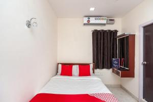 Ένα ή περισσότερα κρεβάτια σε δωμάτιο στο Super Hotel O Le Mint OMR