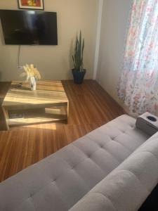 a living room with a couch and a table at Vacation Rental in Paix Bouche