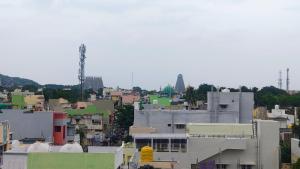 a view of a city with buildings at RHS rooms in Tiruvannāmalai