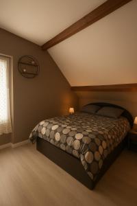 a bedroom with a bed in a room with a window at Cosy Garden DisneyLand in Quincy-Voisins