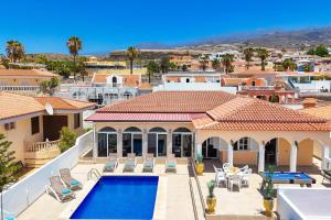 arial view of a house with a swimming pool at Villa Venezuela by Villa Plus in Callao Salvaje