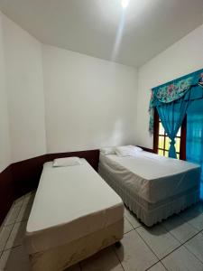 Postel nebo postele na pokoji v ubytování Casa em Benevides Cop 30