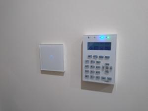 a remote control on a wall on a wall at Apartament Bocianek in Kielce