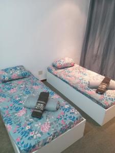 Uma cama ou camas num quarto em Suíte candelária