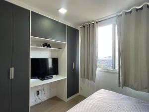 TV a/nebo společenská místnost v ubytování Studio Novo Brás