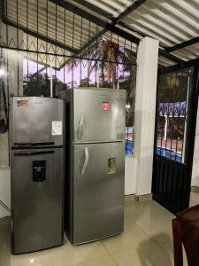 two stainless steel refrigerators standing next to each other at La Juanita in Melgar