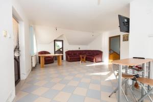 a living room with a couch and a table at Colina Mărului 