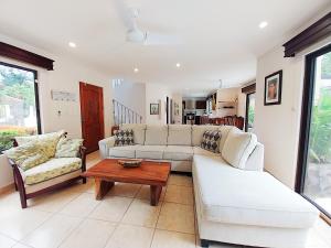 a living room with two couches and a coffee table at Casa Luz de Luna - Comfortable 3 Br, 3,5 Bath house in Potrero