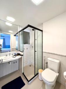 a bathroom with a shower and a toilet and a sink at Ocean View - Camboinhas Beach I 214B in Niterói