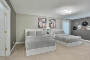 Ένα ή περισσότερα κρεβάτια σε δωμάτιο στο Spacious Family Friendly Royal Residence +27 φωτογραφίες