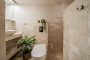 a bathroom with a toilet and a sink at Tähtvere Kodud in Tartu +5 photos