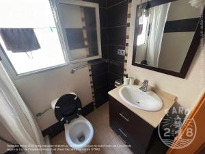 a small bathroom with a toilet and a sink at Faro28 in Valencia +35 photos