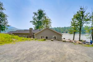 a house on the shore of a lake at Cozy Cabin on Crooked Lake Hike, Ski and Explore! in Averill Park