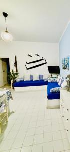 En eller flere senge i et værelse på Le casette di nonna Giulia B