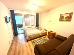 Un pat sau paturi într-o cameră la Willa VICTORIA