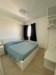 En eller flere senge i et værelse på Casa vacanze Marzamare - Borgo 84