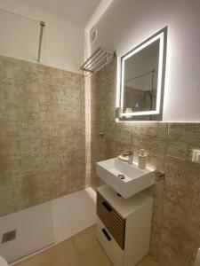 Et badeværelse på Casa vacanze Marzamare - Borgo 84