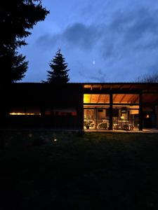 a house is lit up at night at Rest in the mountains in El Bolsón