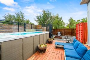 a patio with a hot tub on a deck at Contemporary 3BR Country Gem Swim Spa & Fire Pit in Dripping Springs