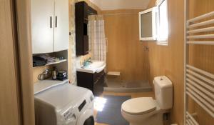 a bathroom with a toilet and a sink at Kallimasia Chios - Iraklis House in Chios +28 photos