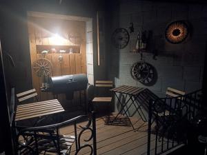 a room with tables and chairs and a door at Horizont in Bulhary +23 photos