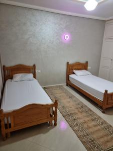 Ένα ή περισσότερα κρεβάτια σε δωμάτιο στο appartement luxe