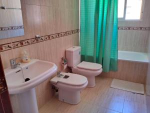 a bathroom with a sink and a toilet and a tub at Studio Nova in Priego de Córdoba +59 photos