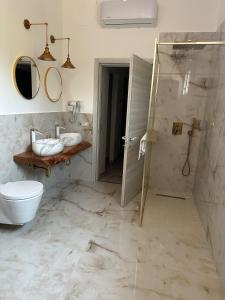 a bathroom with a shower and a toilet at B&B da Matteo in Telese +56 photos