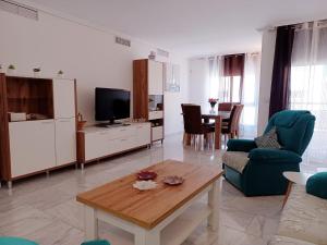 a living room with a couch and a table at APARTAMENTO MORAIRA - 3 Habitaciones in Moraira
