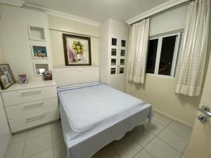 Ένα ή περισσότερα κρεβάτια σε δωμάτιο στο Apartamento Centro Araranguá
